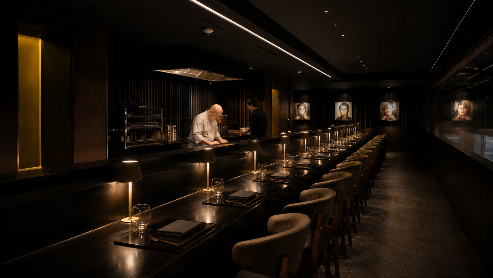 Intimate counter, low light, chefs in motion