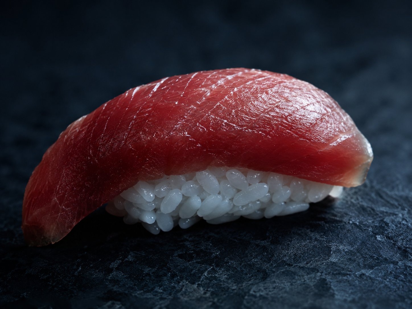 sushi preparation, knife on fish, quiet hands